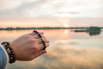 Wall Mural - Bracelet made of natural stone on hand