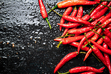 Sticker - Pods of hot chili peppers on the table. 