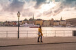 © TambolyPhotodesign - Lady walking by lake maklaren with Gamla stan on the background