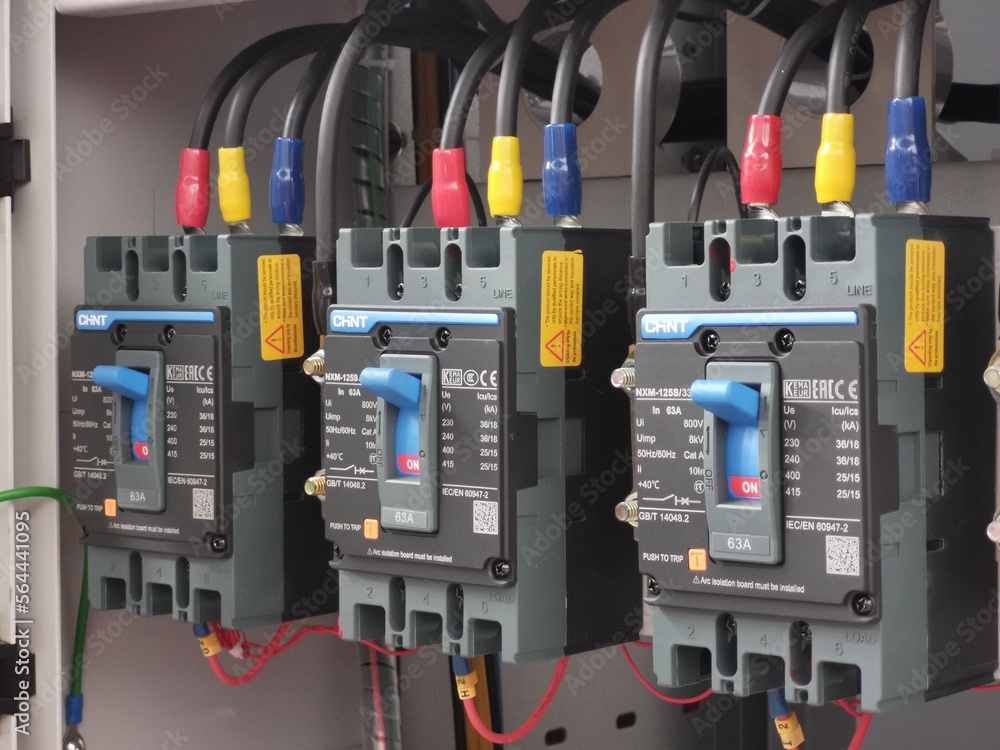 Image of electrical breaker switch mount on metal cabinet by Chint ...