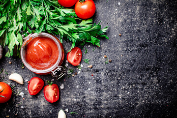 Poster - Tomato sauce in a glass jar with parsley and garlic. 