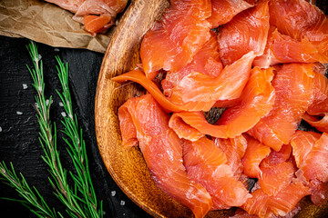 Poster - Salted salmon on a wooden plate with greens. 