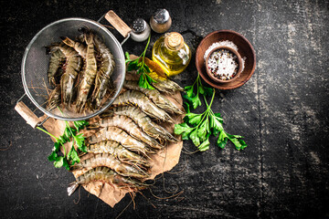 Poster - Raw shrimp on paper with spices and parsley. 