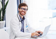 © Joanrae P/peopleimages.com - Doctor, research and healthcare portrait with online service, telehealth advice and mission for hospital management. Clinic or medical professional man or person typing on laptop for virtual support