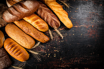 Wall Mural - A variety of delicious bread on the table. 