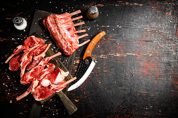 Wall Mural - Sliced raw rack lamb. Against a dark background.