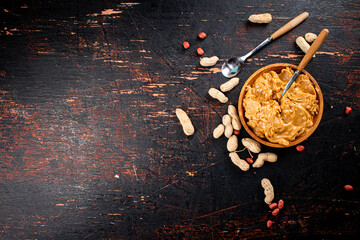 Sticker - Peanut butter on a plate with a spoon. 