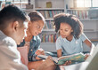© Lumeez/peopleimages.com - Education, storytelling or students reading in a library for group learning development or growth. Diversity, kids or children talking or speaking together for feedback on fun fantasy books at school