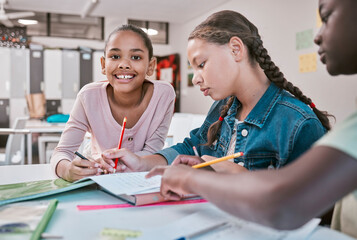 Education, students and portrait of girl in classroom with friends working together on project in Montessori school. Books, help and diversity, children writing or drawing in notebook for homework.