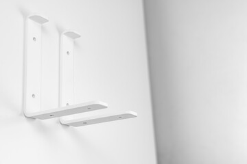 Bracket on a white background. support part for mounting shelves.