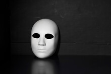 Human Face Mask On A Dark Background, Psychology Concept. Inner Personality
