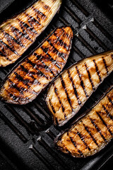 Wall Mural - Slices of eggplant in a grill pan. 