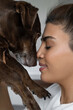 © Chiralli - Close Up Arabic Woman And Her Favorite Pet Dog Dachshund Breed. Concept Of Friendship With Pet, Care, Veterinarian Health Wellbeing Animal