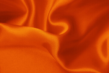 orange fabric cloth texture for background and design art work, beautiful crumpled pattern of silk o