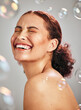 © K. A./peopleimages.com - Beauty, bubble and a happy woman in studio for skincare cosmetics, natural skin glow and dermatology. Facial makeup, health and wellness of aesthetic model person with luxury body product and peace