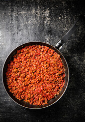 Wall Mural - Delicious bolognese sauce in a frying pan. 