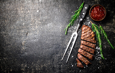 Wall Mural - Grilled steak with a sprig of rosemary. 