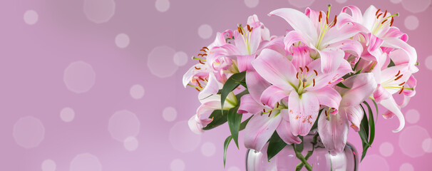 Wall Mural - Beautiful lily flowers bouquet in a glass vase. Lillies. Pink lilies border design. Big bunch of fresh fragrant lilies purple background, polka dots 