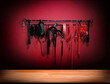 Whips for BDSM on red background in darkside. Accessory for sexual games.