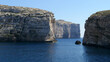 The rugged. Rocky coast of Gozo, Malta. Fungus Rock, Dwejra Bay, Gozo