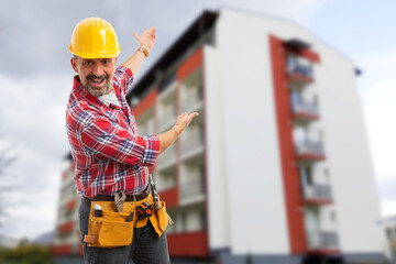 Happy male worker showing construction with hands