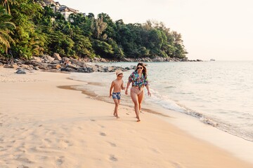 Sticker - Mother and son walking on the Naithon beach in Phuket 