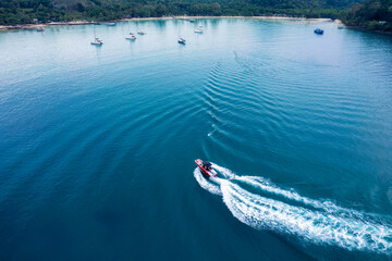 Wall Mural - Speedboat sailing and rippled on tropical sea in summer vacation