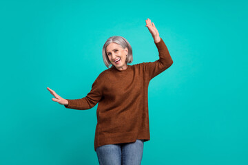 Sticker - Photo of active satisfied aged person dancing enjoy free time isolated on teal color background