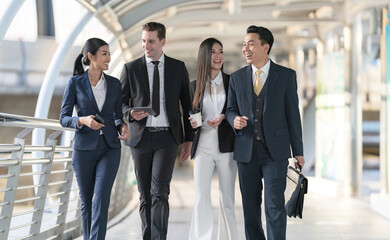 Wall Mural - Business people walking and talk to each other in front of modern office