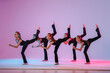 © Maria Moroz - ?hildren dancing. Group of children, little girls in sportive style clothes dancing isolated on background in neon light.