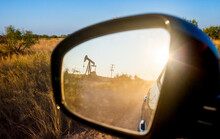 Reflection Of Oil Pump In Side View Mirror
