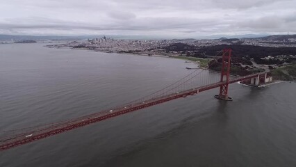 Sticker - Golden Gate Bridge in San Francisco, California. Cityscape and Alcatraz Island in Background. USA. Cloudy Day