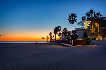 Wall Mural - Palm trees on Playa de las Arenas beach at sunrise, Valencia. Spain