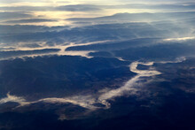 Sunrise Over The Smokey Mountains With Fog Lining The River.