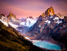 Snow Covered Mountain Peaks And Glacier Under A Pink Sky.   El Chalten, Patagonia, Argentina