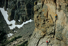 Two Men Rock Climbing In Rocky Mountain National Park. CO.