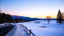 Snowy Field At Sunset In New England Mountains