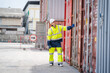 © visoot - Foreman checking loading Containers box for Cargo freight ship for import export,Foreman inspect Industrial Container Cargo.