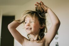 Candid Portrait Of Young Girl With Bed Head Messy Hair After Waking Up