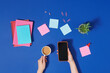 © Marc Tran/Stocksy - Modern workspace with coffee cup and smartphone