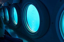 Portholes Of A Small Sub Underwater