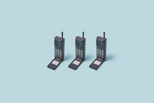 Three 90s Style Flip Cell Phones.