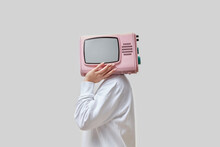 Woman With Pink Retro TV As Head.