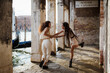© Mauro Grigollo/Stocksy - Happy women holding hands and having fun together in summer