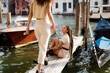 © Mauro Grigollo/Stocksy - Women on a jetty in Venice