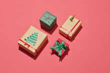 Green, Red And Craft Gift Boxes With Ribbon Isolated On Red