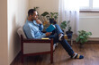 © Demetr White/Stocksy - man in a smart pose reads a book