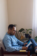 © Demetr White/Stocksy - man reading at home