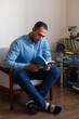 © Demetr White/Stocksy - man reading a book at home
