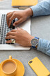 © Demetr White/Stocksy - man hands on laptop keyboard